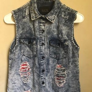 No sleeve jean ripped jacket .